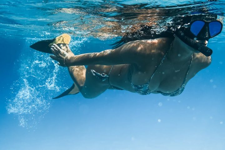 Experience the thrill of snorkeling in Hawaii's crystal-clear waters. Dive in!
